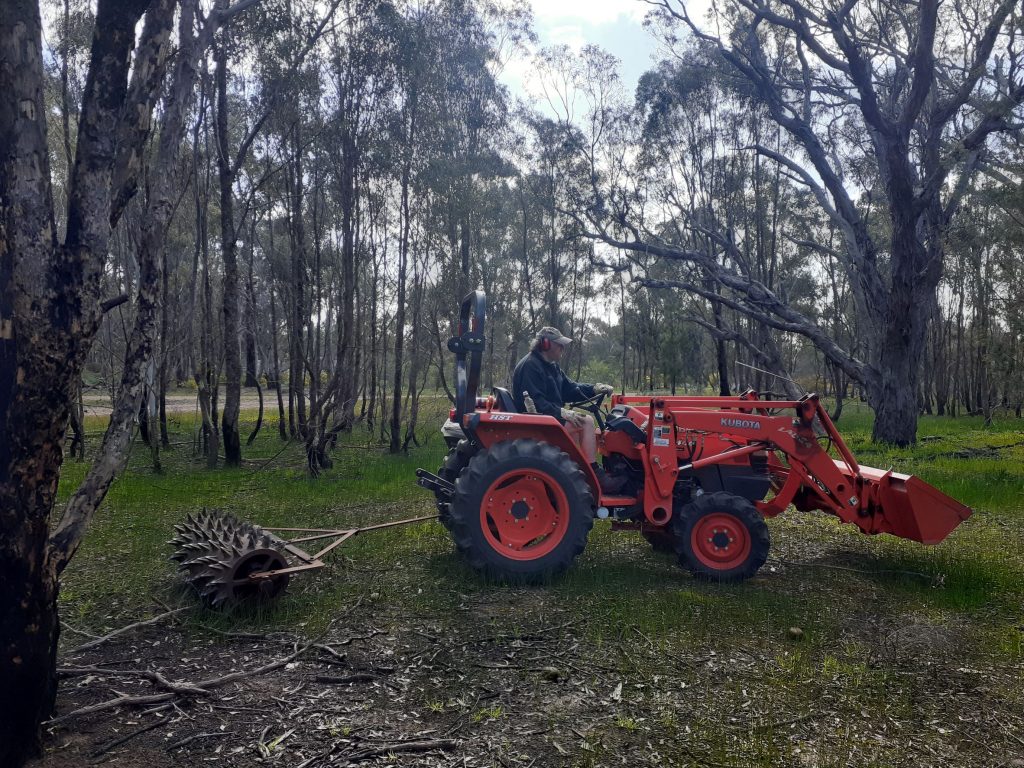 tractor pulling spike roller